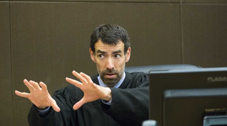 Fulton County Chief Judge Robert McBurney speaks with jurors Friday, the nineteenth day of the McIver trial. McBurney is one of the only judges who allows jurors to ask questions. ALYSSA POINTER/ALYSSA.POINTER@AJC.COM