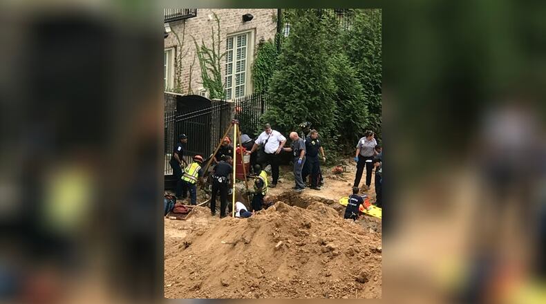 A man was rescued from a hole Thursday in Buckhead. (Credit: Tony Henderson)
