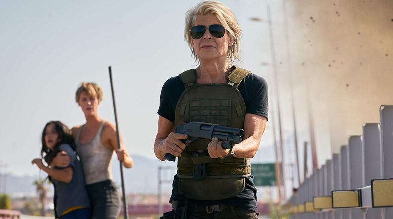 Linda Hamilton in “Terminator: Dark Fate.” In the background are Natalia Reyes and Mackenzie Davis. Paramount Pictures
