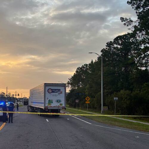 In this photo provided by the St. Johns County Sheriff's Office, the eastbound lanes of SR 16 between Outlet Mall Boulevard and Inman Road in St. Augustine, Fla., are shutdown after a fatal collision. (St. Johns County Sheriff's Office via AP)