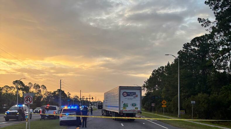 In this photo provided by the St. Johns County Sheriff's Office, the eastbound lanes of SR 16 between Outlet Mall Boulevard and Inman Road in St. Augustine, Fla., are shutdown after a fatal collision. (St. Johns County Sheriff's Office via AP)