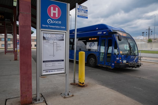 A bus leaves the Pace Harvey Transportation Center, Thursday, May 29, 2025, in Harvey, Ill. (AP Photo/Erin Hooley)