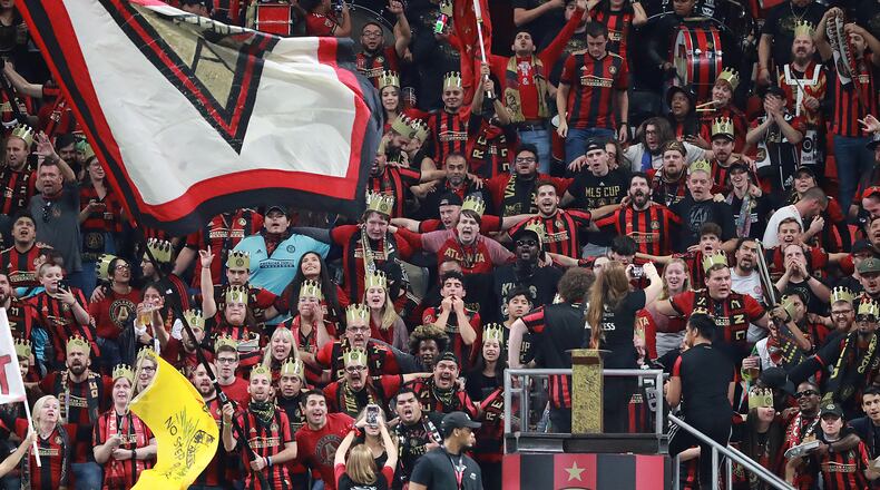 Atlanta United fans sport kings to legends crowns cheering their team on to a 2-0 victory over Philadelphia in the Eastern Conference semifinals of the MLS playoffs on Thursday, Oct. 24, 2019, in Atlanta. Curtis Compton/ccompton@ajc.com
