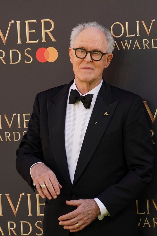 John Lithgow poses for photographers upon arrival at the Olivier Awards on Sunday, April 6, 2025, in London. (Photo by Alberto Pezzali/Invision/AP)