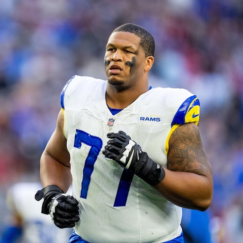 FILE - Los Angeles Rams offensive tackle Alaric Jackson (77) runs off the field at halftime during an NFL football game against the Arizona Cardinals, Dec. 7, 2025, in Glendale, Ariz. (AP Photo/Samantha Chow, File)