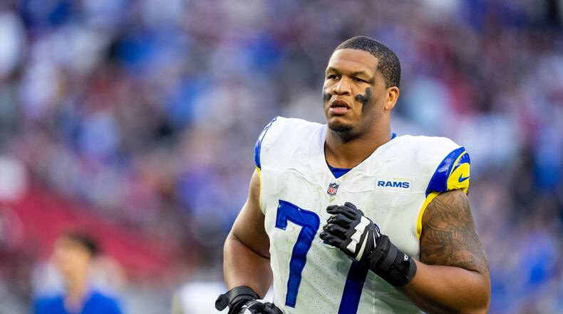 FILE - Los Angeles Rams offensive tackle Alaric Jackson (77) runs off the field at halftime during an NFL football game against the Arizona Cardinals, Dec. 7, 2025, in Glendale, Ariz. (AP Photo/Samantha Chow, File)