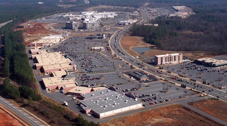 This aerial photo from 1997 shows the sprawling North Point Mall in the background. The area around Ga. 400 would continue to grow and grow into one of metro Atlanta's most important arteries. (John Spink/AJC)