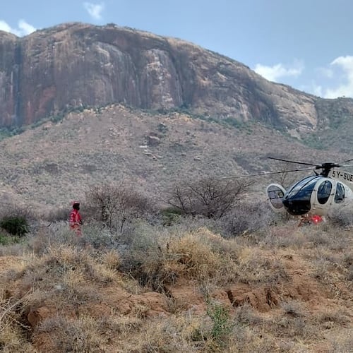 This photo provided by Kenya Red Cross shows Kenya Red Cross emergency response teams during a multi-agency rescue and recovery operation in response to a helicopter crash near Mt. Ololokwe in Samburu, Kenya, Wednesday, Aug. 19, 2026. (Kenya Red Cross via AP) ADDITION: Removes reference to killed tourists