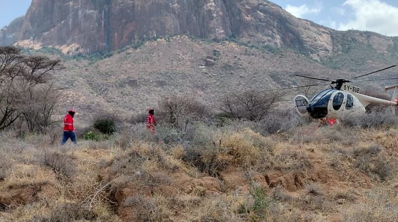 This photo provided by Kenya Red Cross shows Kenya Red Cross emergency response teams during a multi-agency rescue and recovery operation in response to a helicopter crash near Mt. Ololokwe in Samburu, Kenya, Wednesday, Aug. 19, 2026. (Kenya Red Cross via AP) ADDITION: Removes reference to killed tourists