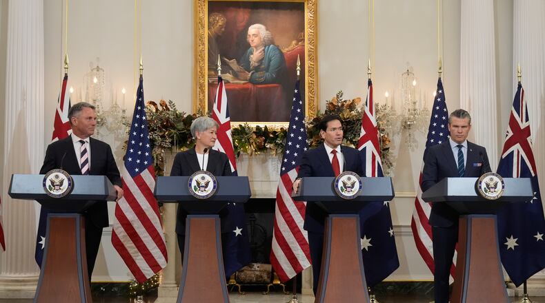 Secretary of State Marco Rubio speaks as Australia's Deputy Prime Minister and Defense Minister Richard Marles, Australia's Foreign Minister Penny Wong and Defense Secretary Pete Hegseth listen at the State Department, Monday, Dec. 8, 2025, in Washington. (AP Photo/Mark Schiefelbein)
