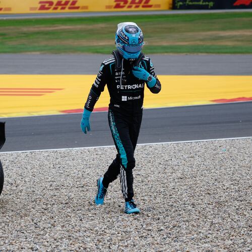 Mercedes driver George Russell of Britain gets out of his car after going off the track during the Formula One Grand Prix at the Spa-Francorchamps racetrack in Spa, Belgium, Sunday, July 19, 2026. (AP Photo/Geert Vanden Wijngaert)