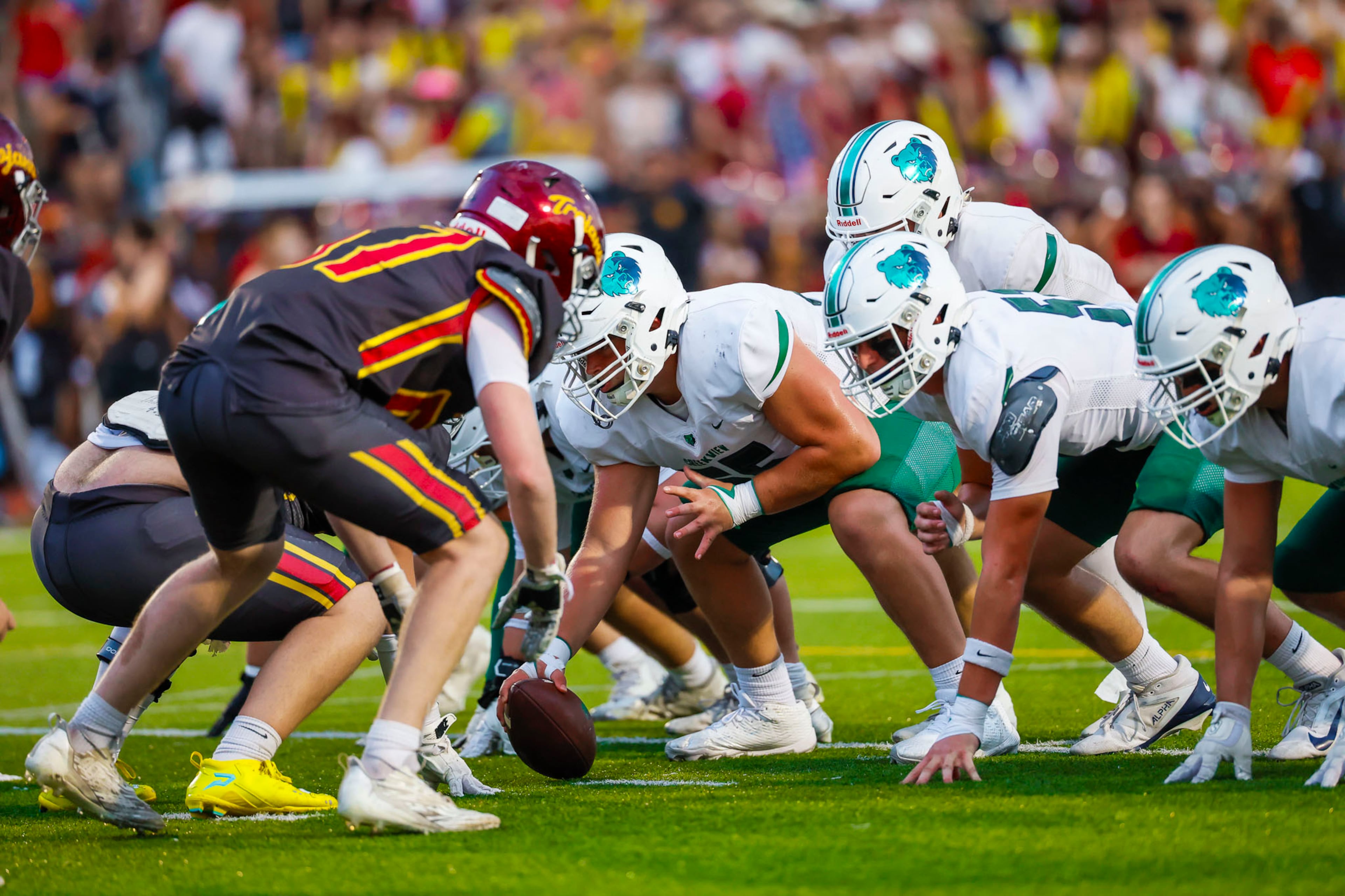Creekview's Caleb Glover (center) lines up in formation during the first half against Lassiter High School on Friday, Sept. 5, 2025, in Marietta. (Oscar Guevara Saenz for the AJC)