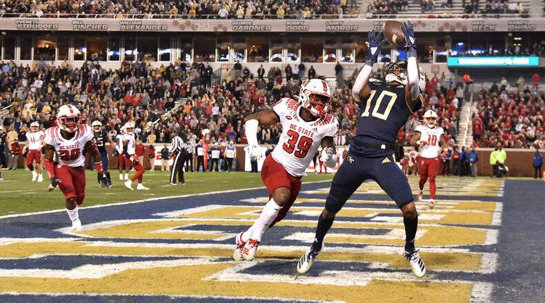 Georgia Tech wide receiver Ahmarean Brown (10) makes a touchdown catch over North Carolina State defensive back Jakeen Harris (39) at Bobby Dodd Stadium on Thursday, November 21, 2019. (Hyosub Shin / Hyosub.Shin@ajc.com)