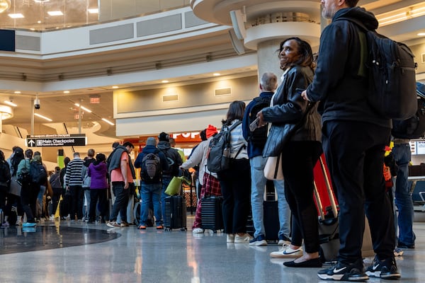 Early morning travelers wait in long lines Hartsfield-Jackson Atlanta International Airport amid the ongoing partial government shutdown, Wednesday, March 18, 2026. (Ben Hendren for the AJC)