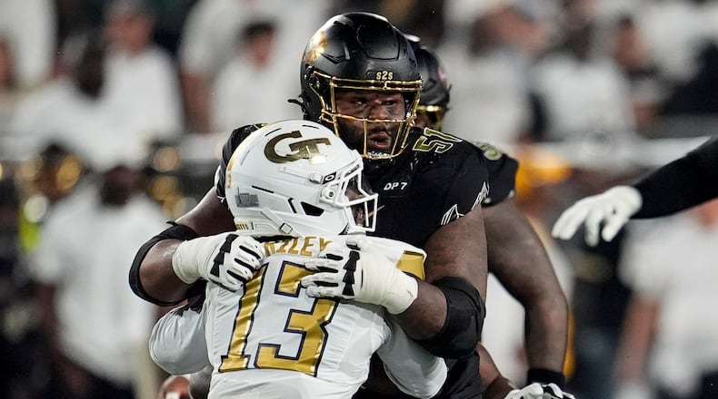Colorado offensive lineman Chauncey Gooden (51) blocks Georgia Tech safety Savion Riley (13) during the first half of an NCAA college football game, Thursday, Sept. 3, 2026, in Atlanta. (AP Photo/Mike Stewart)