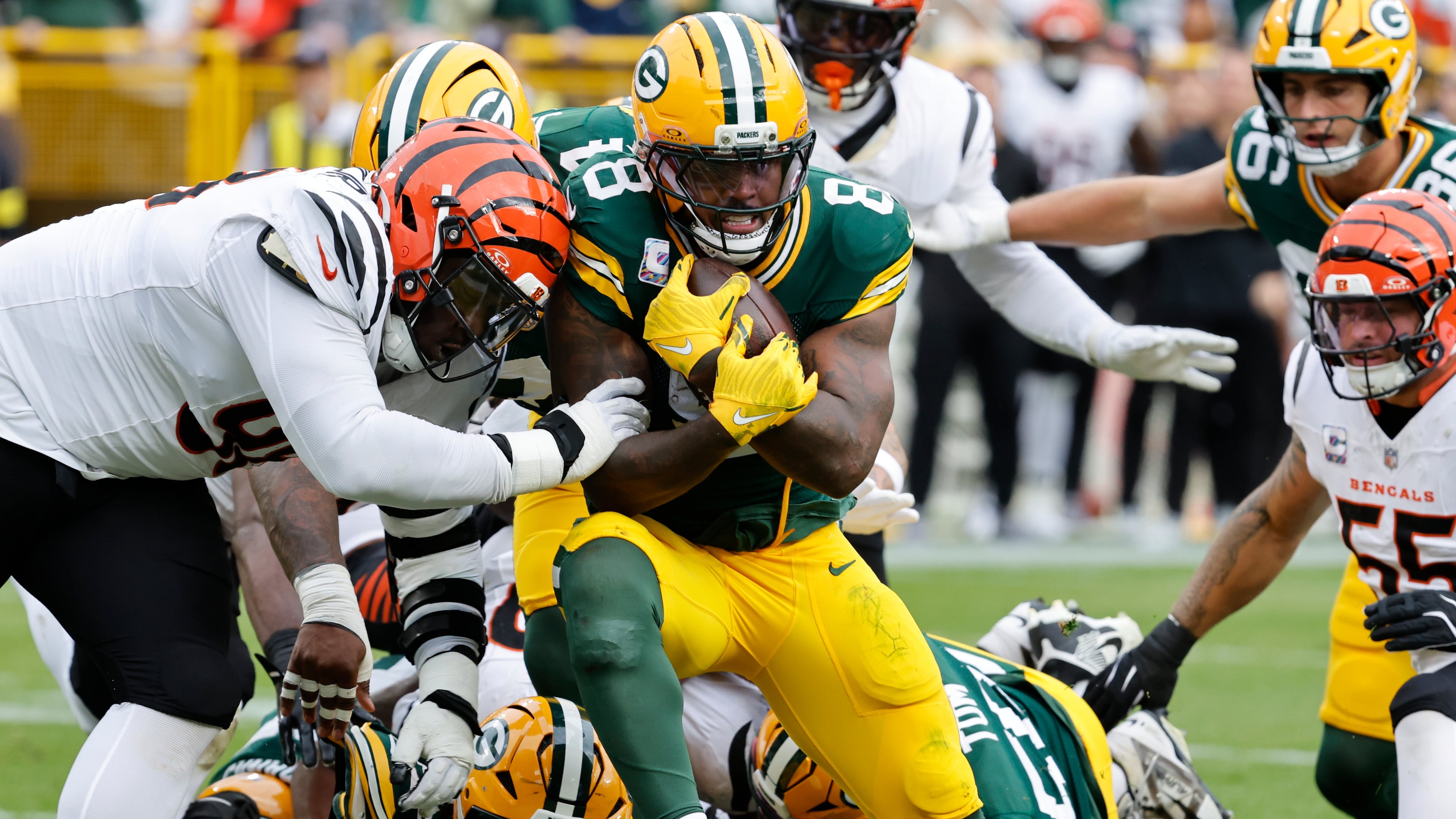 Green Bay Packers running back Josh Jacobs (8) scores a touchdown against the Cincinnati Bengals in the first half of an NFL football game, Sunday, Oct. 12, 2025, in Green Bay, Wis. (AP Photo/Mike Roemer)