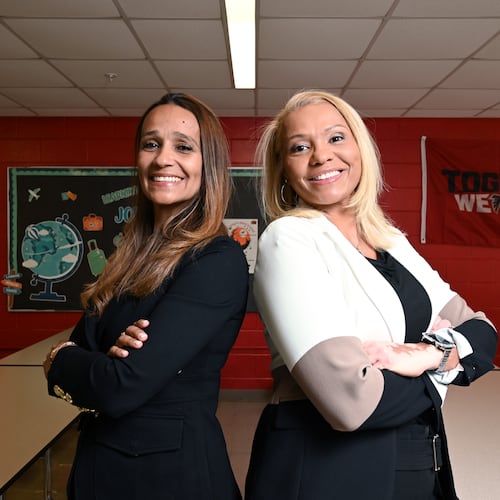 Kimberly Gibbs (left) and Kristy Reese pose for a portrait at L.O. Kimberly Elementary School, Thursday, Oct. 23, in Atlanta. Reese is principal of Kimberly Elementary School, while her sister, Kimberly Gibbs, is principal of Martin Luther King Jr. Middle School. (Hyosub Shin/AJC)