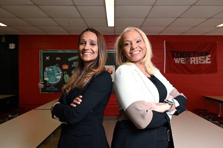 Kimberly Gibbs (left) and Kristy Reese pose for a portrait at L.O. Kimberly Elementary School, Thursday, Oct. 23, in Atlanta. Reese is principal of Kimberly Elementary School, while her sister, Kimberly Gibbs, is principal of Martin Luther King Jr. Middle School. (Hyosub Shin/AJC)