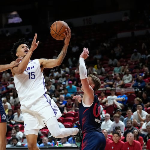 Utah Jazz's Trey Alexander shoots against LA Clippers' Kobe Sanders, left, and LA Clippers' Sean Pedulla during the second half of an NBA Summer League basketball game Sunday, July 12, 2026, in Las Vegas. (AP Photo/John Locher)