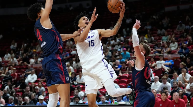 Utah Jazz's Trey Alexander shoots against LA Clippers' Kobe Sanders, left, and LA Clippers' Sean Pedulla during the second half of an NBA Summer League basketball game Sunday, July 12, 2026, in Las Vegas. (AP Photo/John Locher)