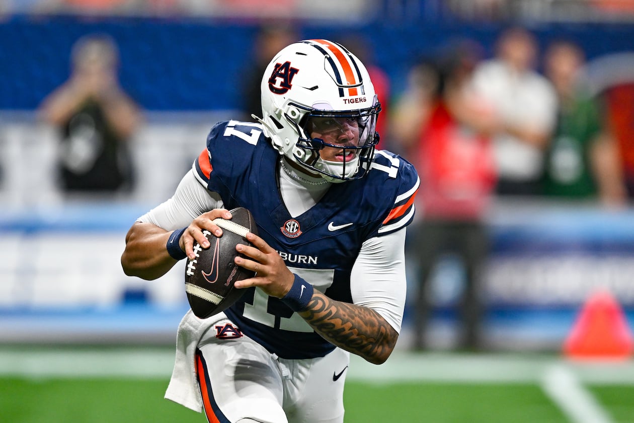 Auburn quarterback Byrum Brown rolls out to pass during the Aflac Kickoff Game between the Baylor Bears and the Auburn Tigers on September 5, 2026, at Mercedes-Benz Stadium in Atlanta, GA. (Photo by Rich von Biberstein/Icon Sportswire) (Icon Sportswire via AP Images)