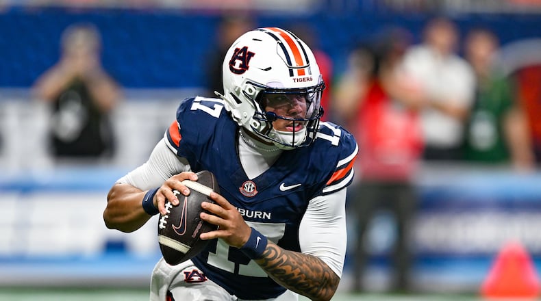 Auburn quarterback Byrum Brown rolls out to pass during the Aflac Kickoff Game between the Baylor Bears and the Auburn Tigers on September 5, 2026, at Mercedes-Benz Stadium in Atlanta, GA. (Photo by Rich von Biberstein/Icon Sportswire) (Icon Sportswire via AP Images)