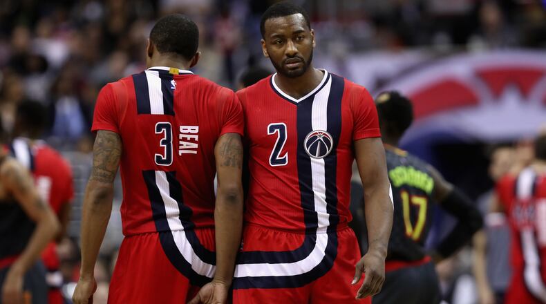 WASHINGTON, DC - MARCH 22: Bradley Beal #3 of the Washington Wizards and John Wall #2 of the Washington Wizards talk on the floor in the second half against the Atlanta Hawks at Verizon Center on March 22, 2017 in Washington, DC. NOTE TO USER: User expressly acknowledges and agrees that, by downloading and or using this photograph, User is consenting to the terms and conditions of the Getty Images License Agreement. (Photo by Rob Carr/Getty Images)