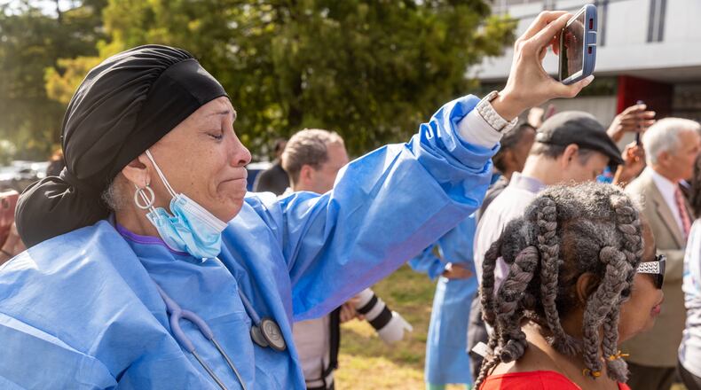 WellStar Atlanta Medical Center nurse Melody Reddington becomes emotional listening to Stacey Abrams talk at a press conference outside the hospital Friday, Sep. 02, 2022. Steve Schaefer/steve.schaefer@ajc.com)