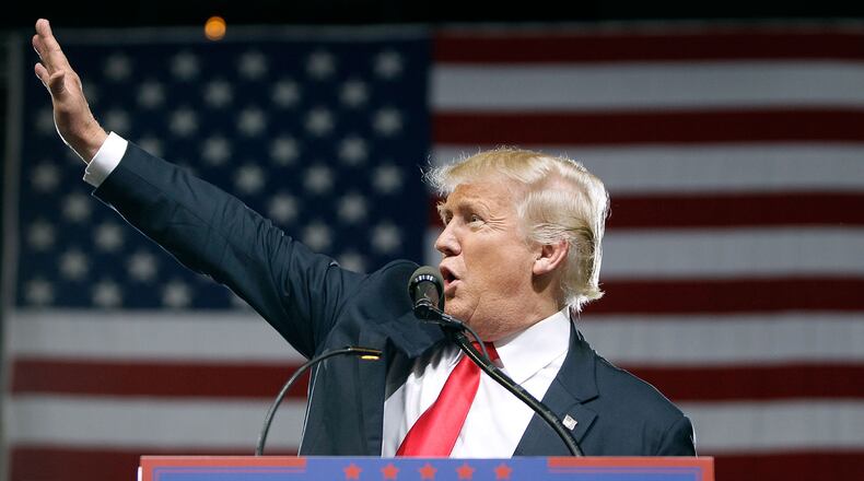 PHOENIX, AZ - JUNE 18:  Republican presidential candidate Donald Trump waves to the crowd of supporters during a campaign rally on June 18, 2016 in Phoenix, Arizona. Trump returned to Arizona for the fourth time since starting his presidential campaign a year ago.   (Photo by Ralph Freso/Getty Images) ***BESTPIX***