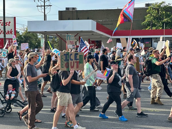 Demonstrators carry signs and chant while marching during a “No Kings” protest, Saturday, June 14, 2025, in Salt Lake City. (AP Photo/Amanda Barrett)