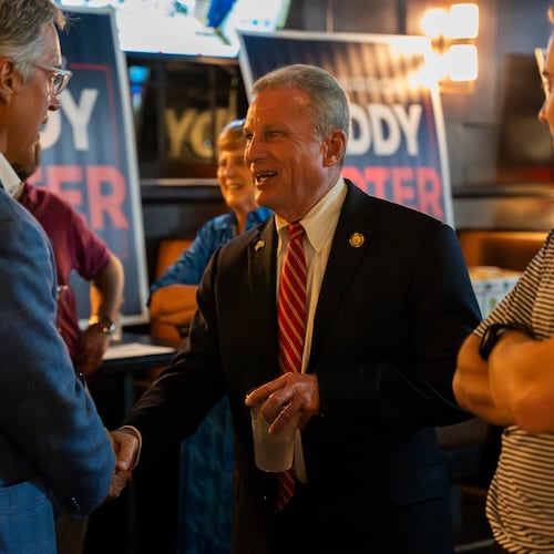 Buddy Carter greets supporters while watching primary results roll in during his watch party in Sandy Springs last month. (Olivia Bowdoin for the AJC)