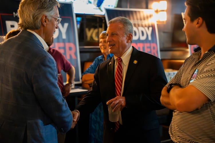 Buddy Carter greets supporters while watching primary results roll in during his watch party in Sandy Springs last month. (Olivia Bowdoin for the AJC)