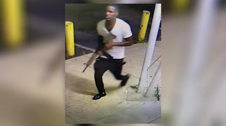 Authorities have released surveillance photos of a person of interest in the July 4 shooting death of 8-year-old Secoriea Turner.