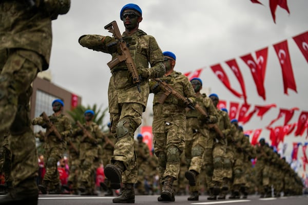 FILE - Turkey's Forces officers parade for Victory Day, in Istanbul, Friday, Aug. 30, 2024. (AP Photo/Khalil Hamra, File)