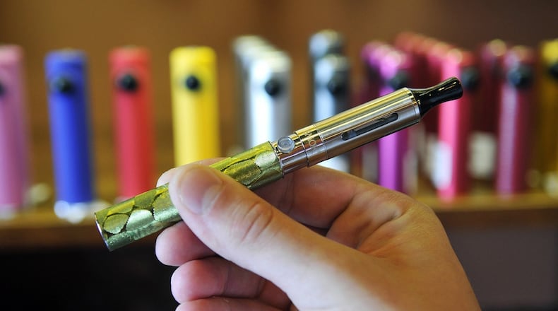 The electronic cigarette consists of a battery on the bottom and a bottom-coiled tank on top. Electronic cigarettes are growing in popularity, but concern still lingers nationwide about their safety. e-Cig culture includes "vaping" meet-ups and an array of build-your-own products. (Diedra Laird/Charlotte Observer/MCT)