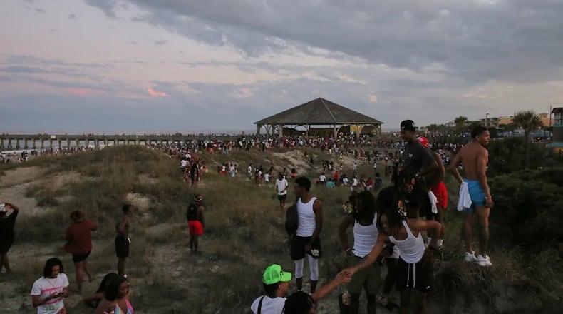 People leaving the beach in a hurry after, apparently, someone flashed their gun at another person during Orange Crush on Tybee Island, Saturday, April 22. (Photo Courtesy of RJ Smith/ Savannah Morning News)