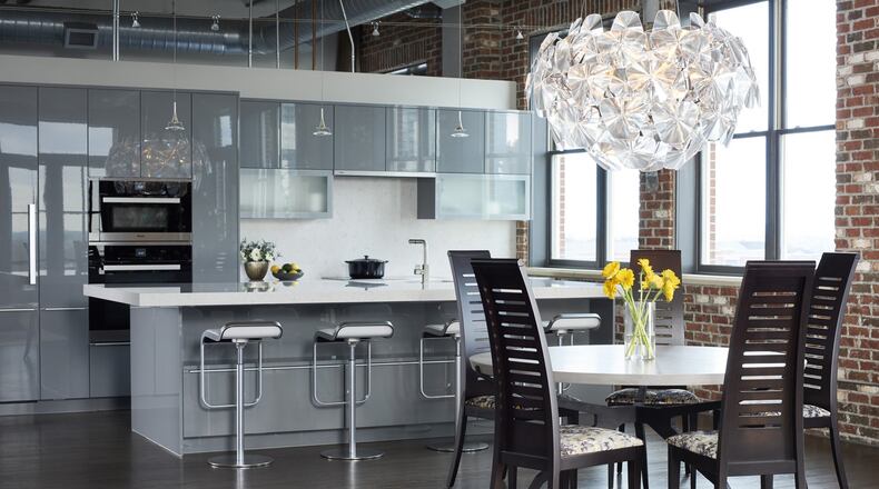 The Buckhead loft was renovated with a new kitchen (Poggenpohl, Atlanta) and a new cocktail bar designed by McAlear and New Mood Design. McAlear also chose new surface finishes (from wall colors to floor stain), lighting, furniture, artwork, and accessories. Contributed by Marc Mauldin Photography