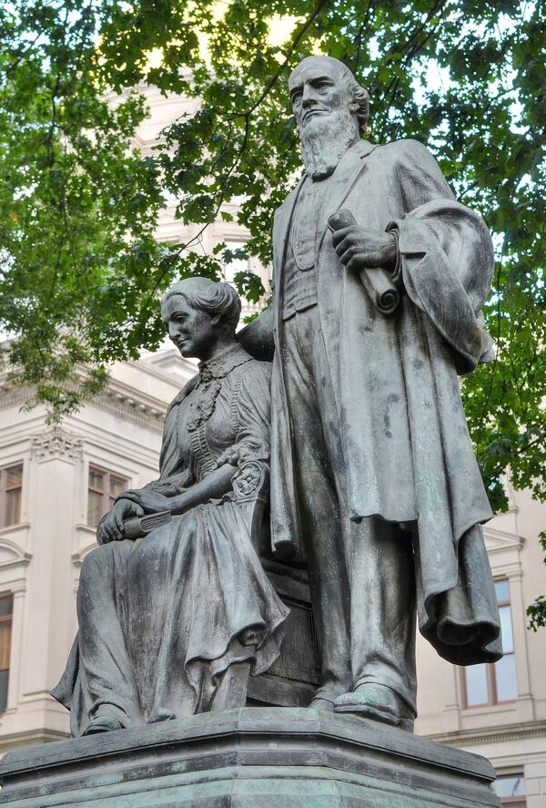 A statue of former Georgia Gov. Joseph Brown and his wife, Elizabeth, stands just outside the State Capitol. Brown was governor during the Civil War when the Constitution of 1861 was drafted. In a recent decision, the Georgia Supreme Court went back to that Confederate-era document to determine the original intent of court’s authority to review the constitutionality of state laws. (CHRIS HUNT / SPECIAL)