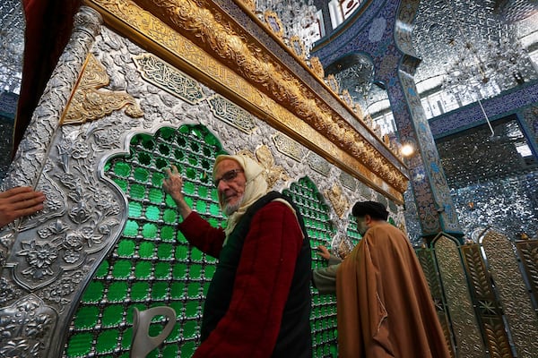 Shiite worshippers pray at the Sayyida Zeinab shrine where many Shiite Muslims believe Zeinab, the granddaughter of Prophet Muhammad is entombed, in Sayyida Zeinab, south of Damascus, Syria, Saturday March 15, 2025.(AP Photo/Omar Sanadiki)