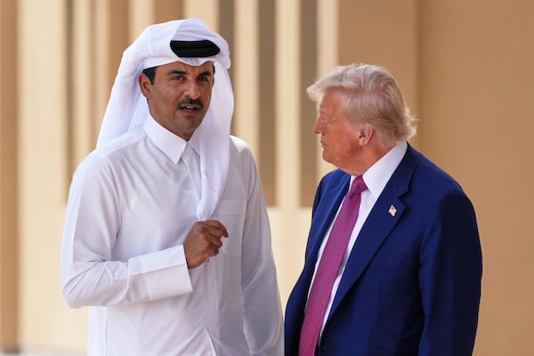 President Donald Trump and Qatar's Emir Sheikh Tamim bin Hamad Al Thani speak at Al Udeid Air Base, Thursday, May 15, 2025, in Doha, Qatar. (AP Photo/Alex Brandon)