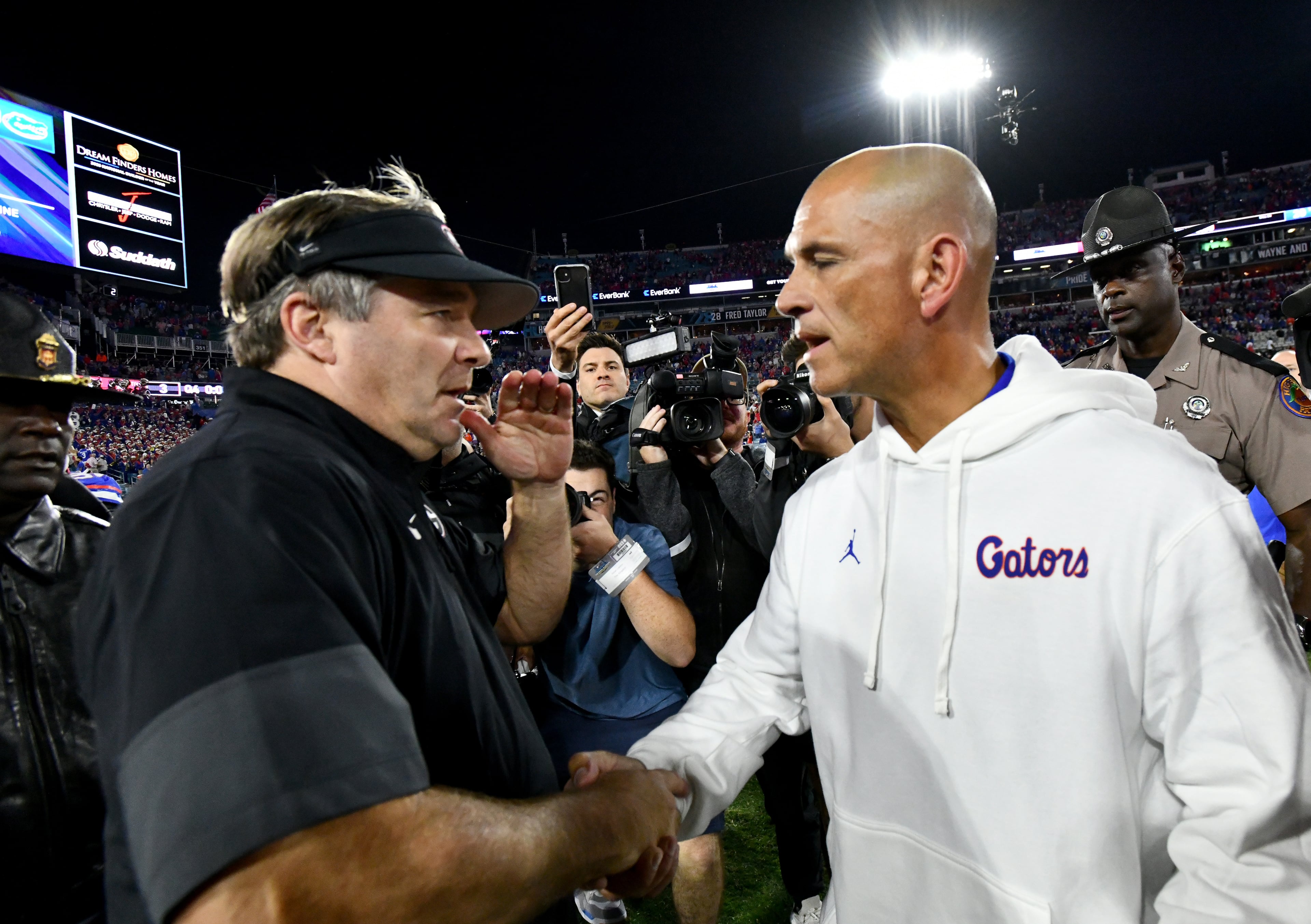 Georgia head coach Kirby Smart and Florida interim head coach Billy Gonzales shake hands after Georgia beat Florida during an NCAA football game, Saturday, November 1, 2025, Jacksonville, Fla. Georgia won 24-20 over Florida. (Hyosub Shin / AJC)