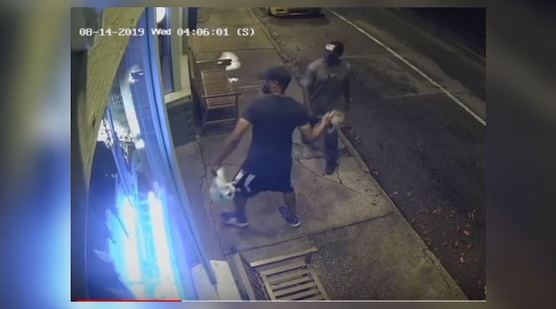 Atlanta police are searching for two men who stole at least 12 bottles of alcohol from a popular Inman Park pub two weeks ago.