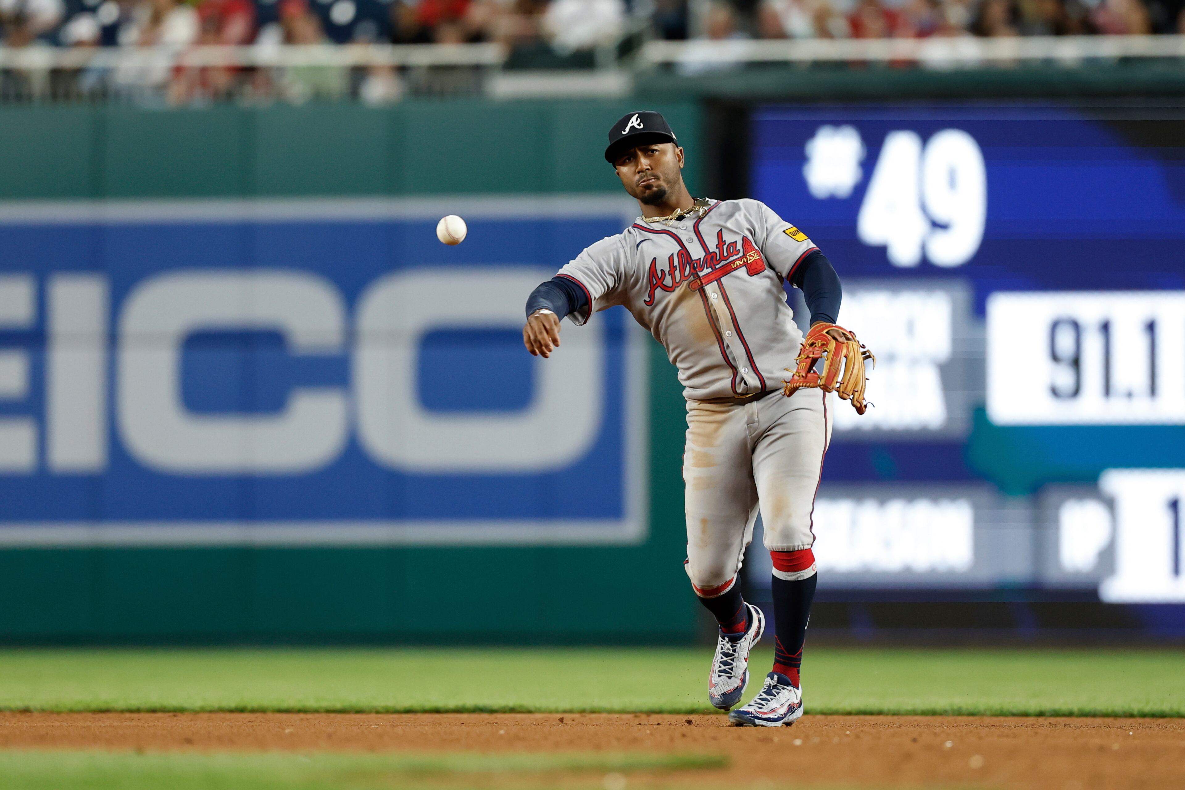 Atlanta Braves second baseman Ozzie Albies throws to first base for an out on a ball hit by Washington Nationals' Luis García Jr. during the sixth inning of a baseball game in Washington, Tuesday, May 20, 2025. (AP Photo/Terrance Williams)