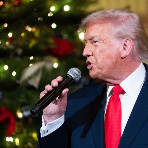 President Donald Trump speaks before a concert by Andrea Bocelli in the East Room of the White House walking towards the East Room, Friday, Dec. 5, 2025, in Washington. (AP Photo/Allison Robbert)
