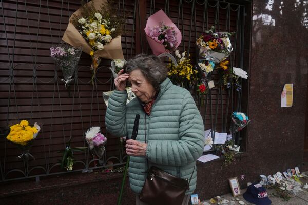 Alicia Gigante, 91, stands outside the childhood home of Jorge Bergoglio, who later became Pope Francis, in Flores neighborhood where he grew up in Buenos Aires, Argentina, Thursday, April 24, 2025. (AP Photo/Natacha Pisarenko)