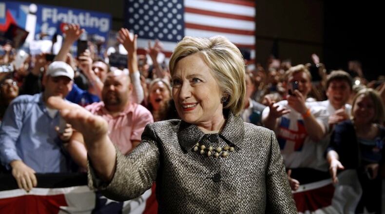 FILE - In this April 26, 2016 file photo, Democratic presidential candidate Hillary Clinton moves to the stage at her presidential primary election night rally in Philadelphia. Bernie Sanders defied expectations to turn his long-shot presidential bid into a real threat for the Democratic nomination. But as his path to the White House becomes all-but-impossible, some of his supporters are lashing out at a system they believe was engineered against them from the start. (AP Photo/Matt Rourke, File)