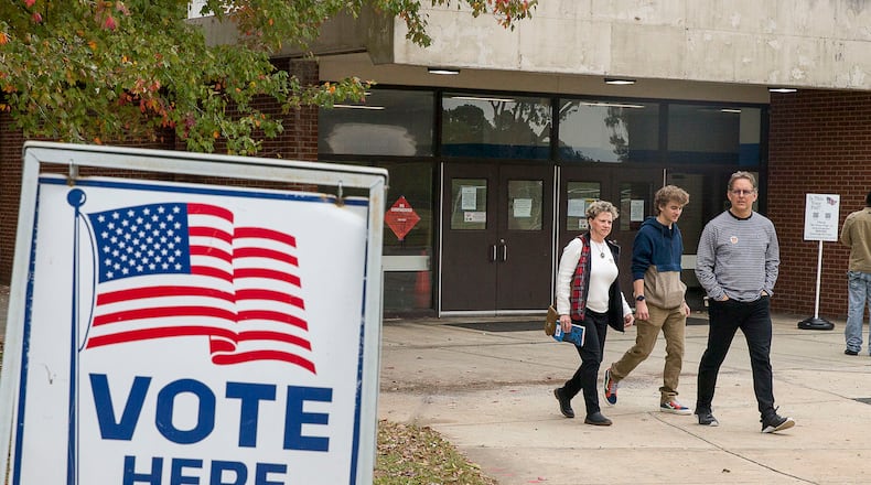 Jeff Brown (right), his wife Melony Brown (left) and their son Palmer Brown, leave Campbell Middle School after Jeff and Melony cast their ballots during Election Day in Smyrna, Tuesday, November 5, 2019.  Both Jeff and Melony were able to cast their votes while Palmer, 18, who recently missed the registration date, was unable. Palmer plans on registering and voting in the upcoming 2020 elections. (Alyssa Pointer/Atlanta Journal Constitution)