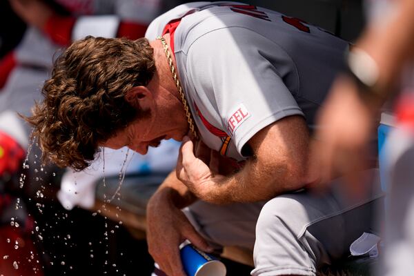 St. Louis Cardinals pitcher Miles Mikolas (39) cools off in the dugout in the fifth inning of a baseball game against the Atlanta Braves, Wednesday, April 23, 2025, in Atlanta. (AP Photo/Mike Stewart)