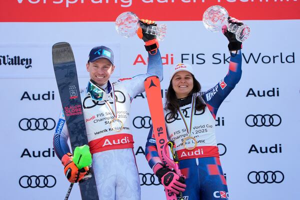 Norway's Henrik Kristoffersen, left, and Croatia's Zrinka Ljutic pose after winning their World Cup slalom season titles at the World Cup Finals, Thursday, March 27, 2025, in Sun Valley, Idaho. (AP Photo/John Locher)