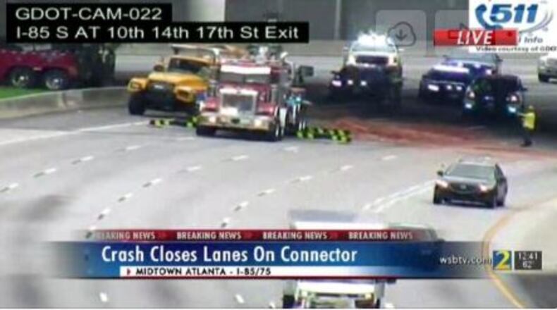 The truck overturned under an overpass in the northbound lanes near the 17th Street exit.
